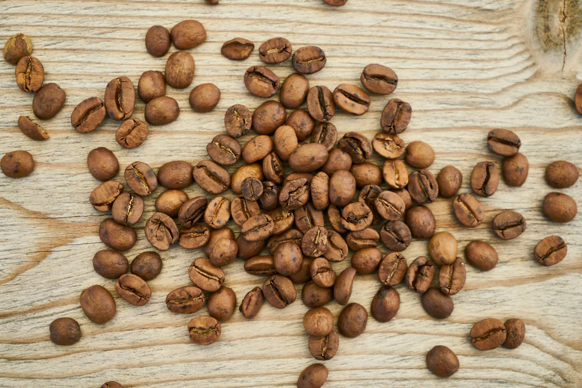 https://www.pexels.com/photo/flat-lay-photography-of-coffee-beans-on-wooden-surface-2478343/